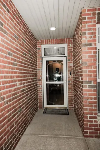 a view of an empty room with a fireplace