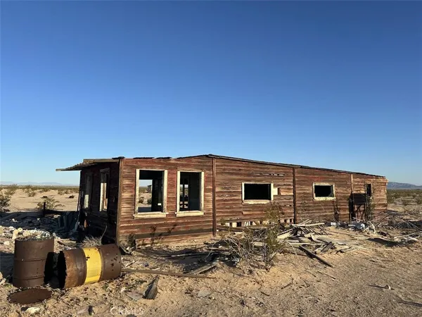 a front view of a house with parking space