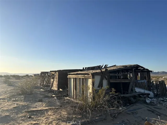 a view of a house with a yard and balcony