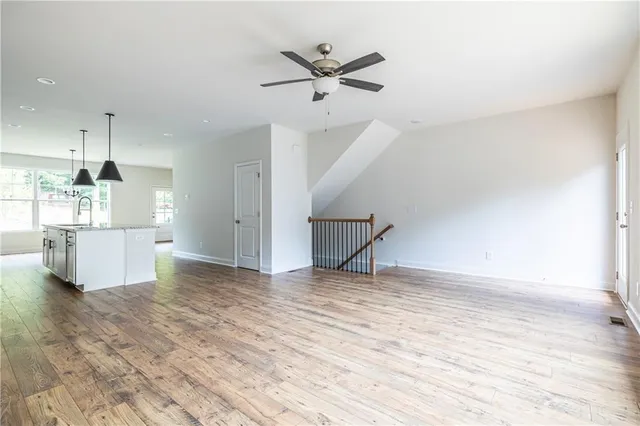 a view of a kitchen with a sink and a refrigerator