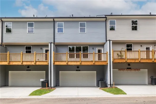 a front view of a building with a yard