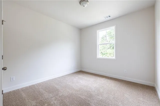 a bathroom with a sink toilet vanity and shower