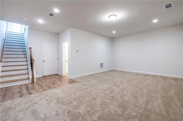 an empty room with staircase and stairs