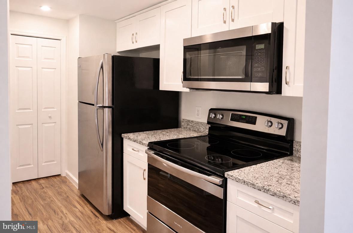 8503 Falls Run Road, Unit B Ellicott City, MD 21043 - Photo 7 of 23 Modern kitchen with sleek appliances.