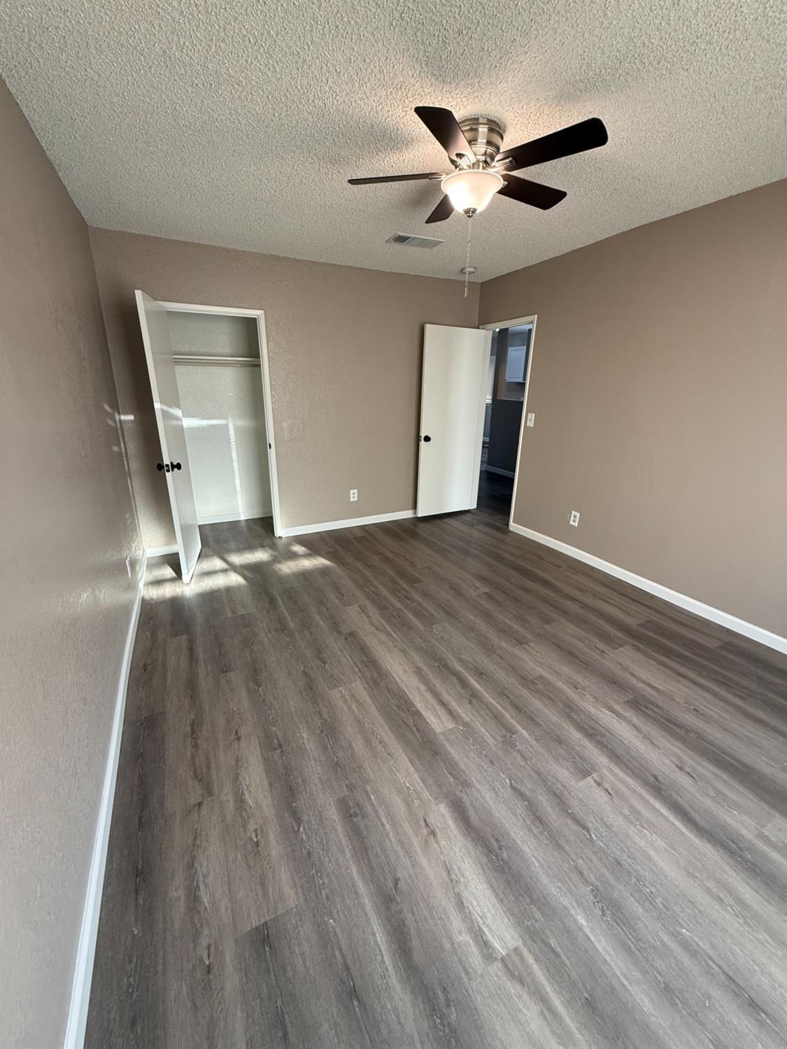 460 South Dearing Avenue Fresno, CA 93702 - Photo 19 of 23 a view of an empty room and chandelier fan