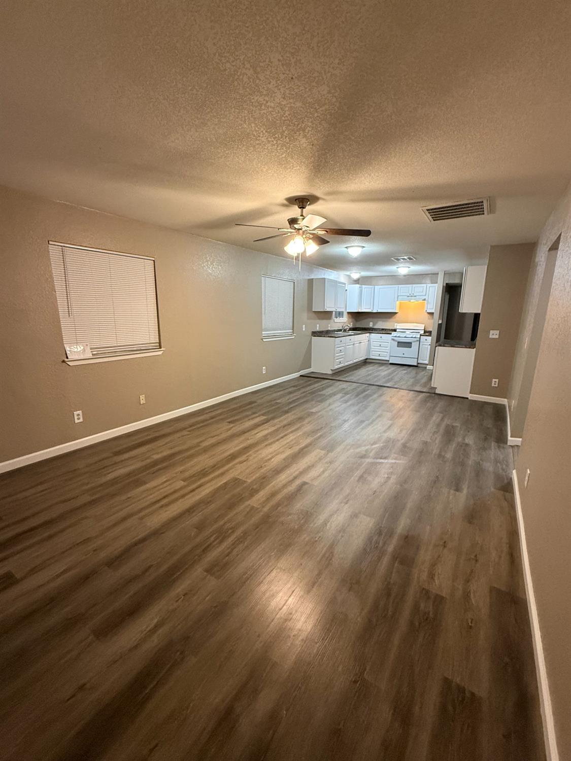 460 South Dearing Avenue Fresno, CA 93702 - Photo 2 of 23 a view of a livingroom with wooden floor