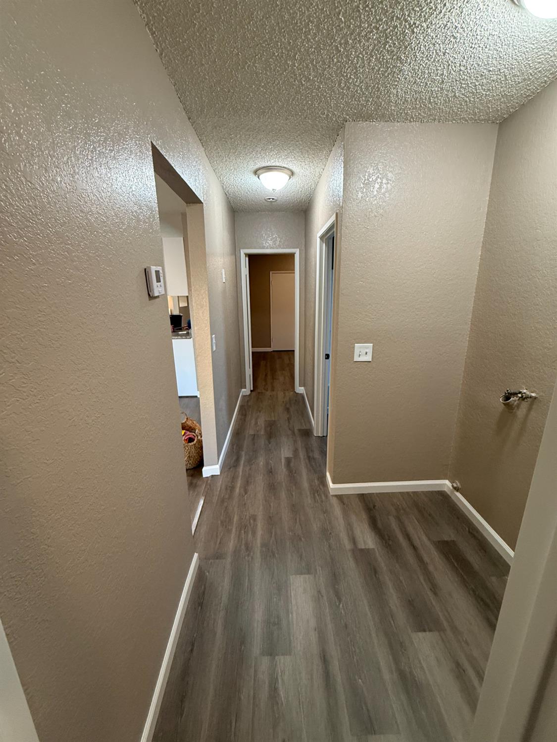 460 South Dearing Avenue Fresno, CA 93702 - Photo 6 of 23 a view of hallway with wooden floor