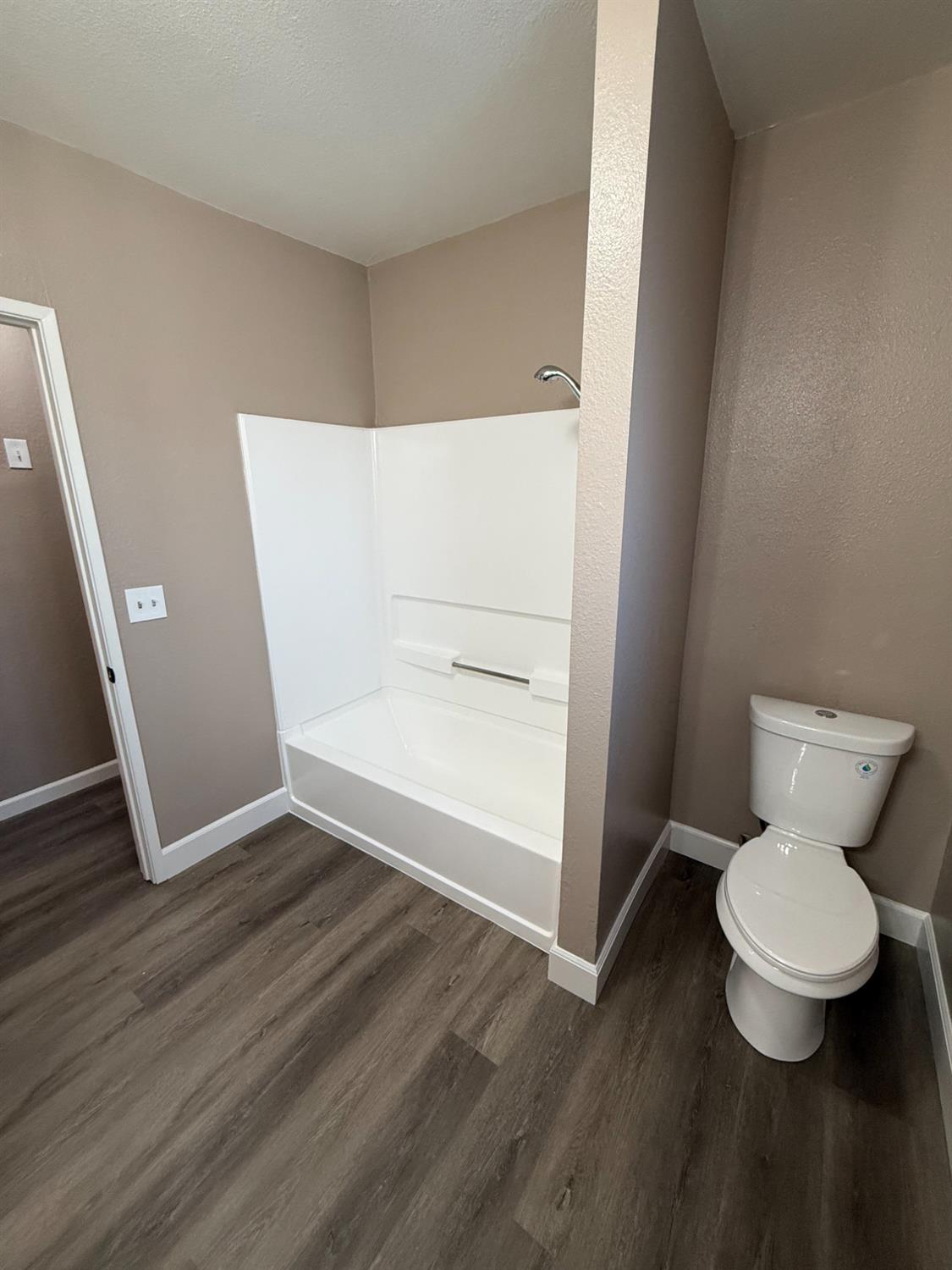 460 South Dearing Avenue Fresno, CA 93702 - Photo 9 of 23 a bathroom with a toilet and a shower