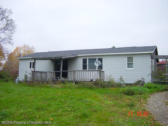 136 A Retta Road Montrose, PA 18801 - Photo 1 of 4 a view of a house with a yard and sitting area