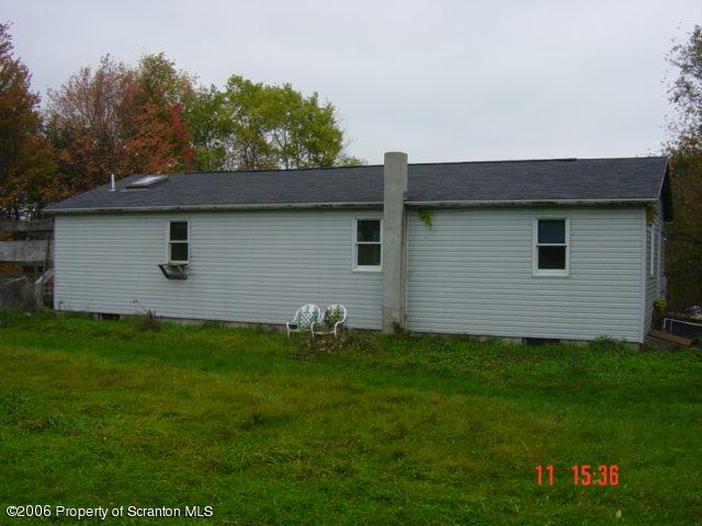 136 A Retta Road Montrose, PA 18801 - Photo 4 of 4 a front view of a house with garden