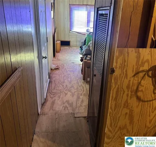 a bathroom with a sink and glass door