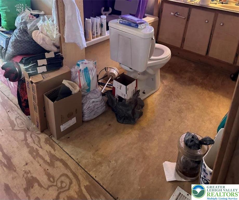 19 Roth Avenue Mertztown, PA 19539 - Photo 12 of 26 a living room with furniture and a fireplace