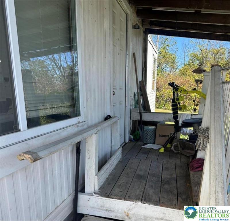 19 Roth Avenue Mertztown, PA 19539 - Photo 4 of 26 a view of a two chairs in the balcony
