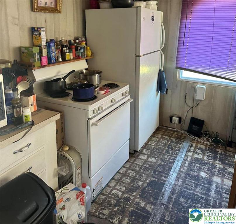 19 Roth Avenue Mertztown, PA 19539 - Photo 10 of 26 a kitchen with a refrigerator and cabinets