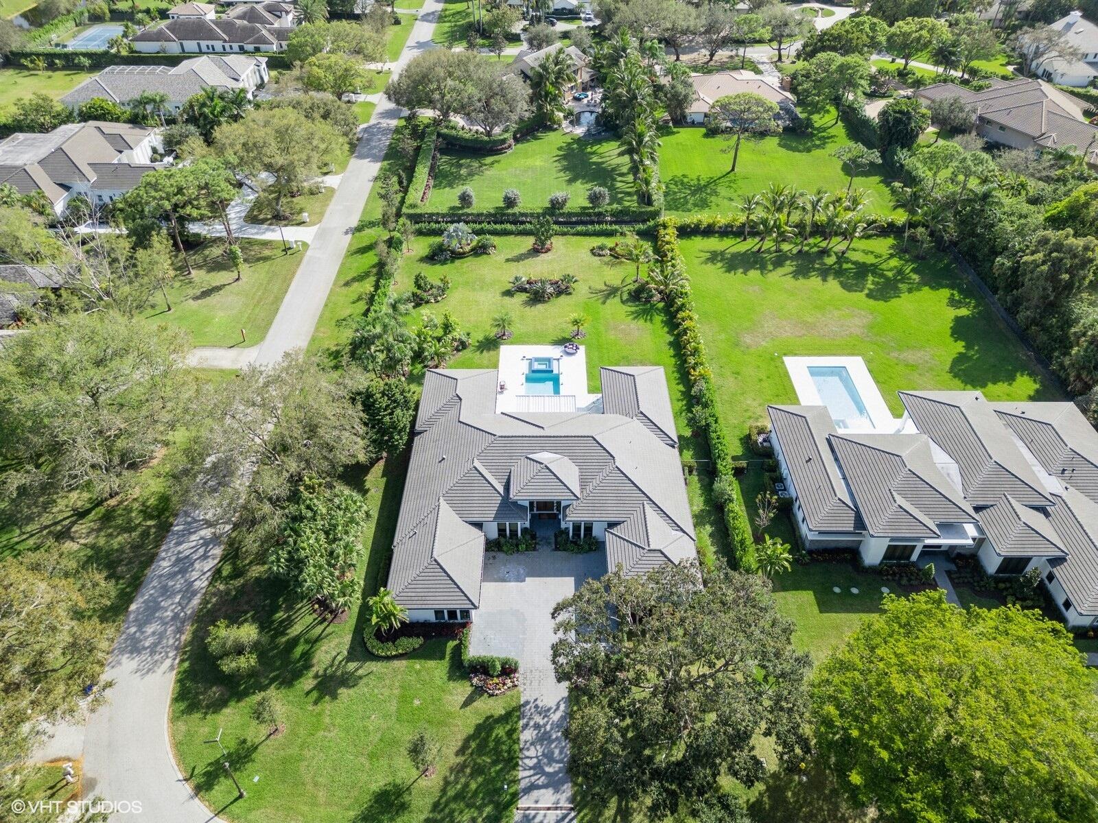 8533 North Native Dancer Road Palm Beach Gardens, FL 33418 - Photo 60 of 61 93_8533NativeDancerRdE_181001_AerialView