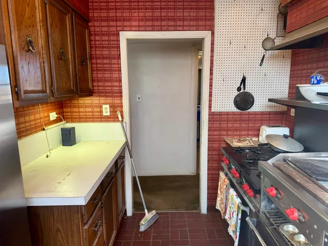 a white toilet sitting next to a shower curtain