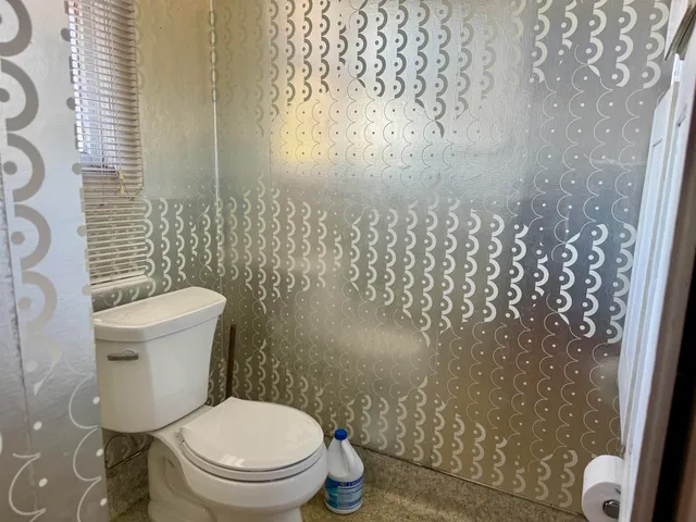 a bathroom with a tub and shower