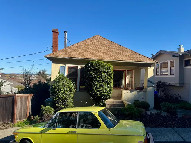 a view of a house with pool table and chairs