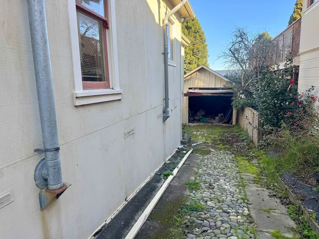 a view of house with backyard