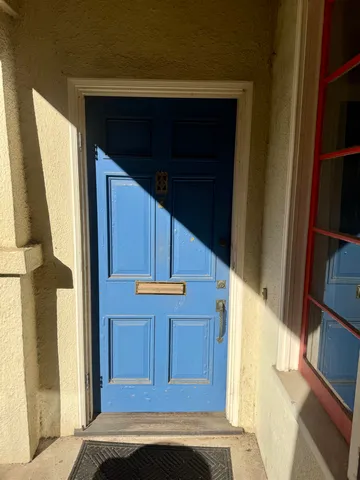 a balcony with furniture and window