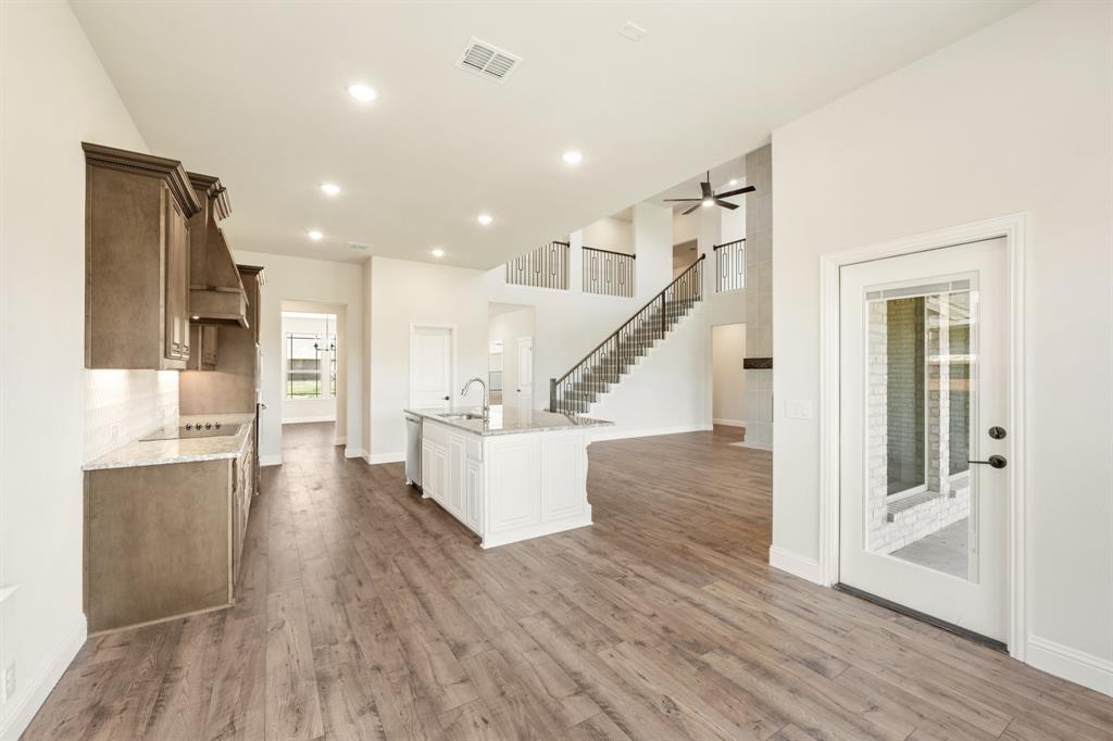 721 Seahawk Street Joshua, TX 76058 - Photo 12 of 40 a view of kitchen with furniture and wooden floor