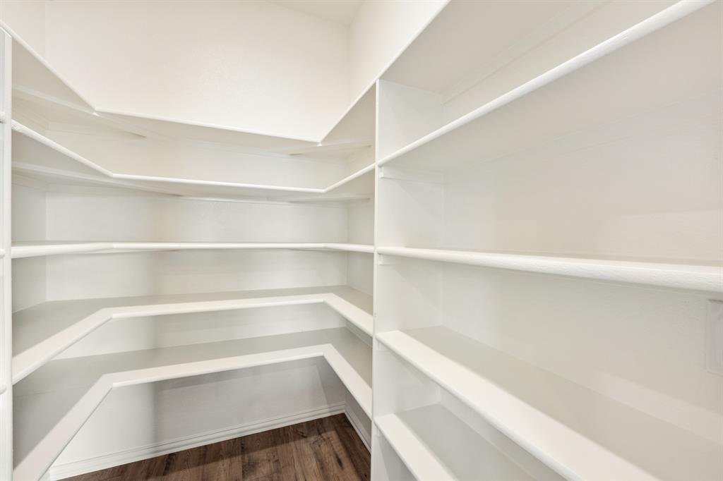 721 Seahawk Street Joshua, TX 76058 - Photo 16 of 40 a view of walk in closet with empty racks