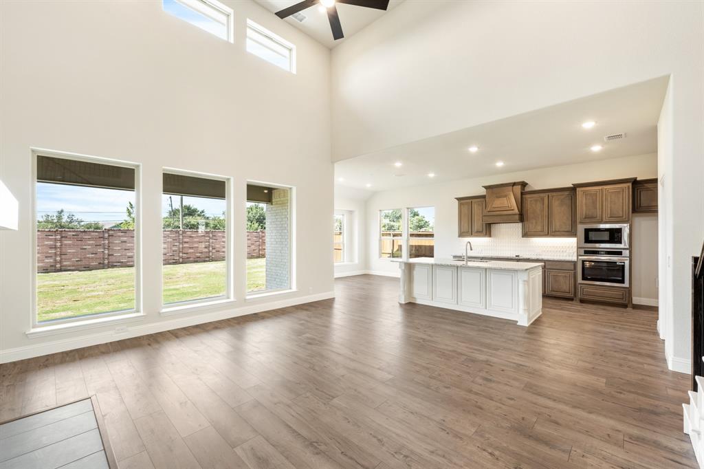 721 Seahawk Street Joshua, TX 76058 - Photo 18 of 40 a view of kitchen with kitchen island and stainless steel appliances