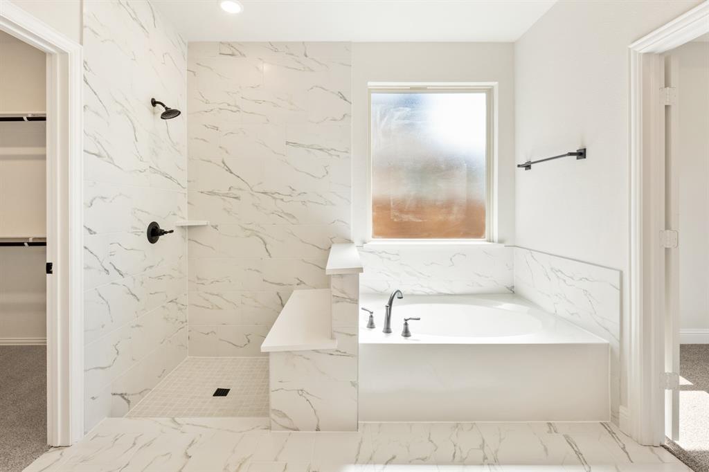 721 Seahawk Street Joshua, TX 76058 - Photo 22 of 40 a bathroom with a bathtub and shower