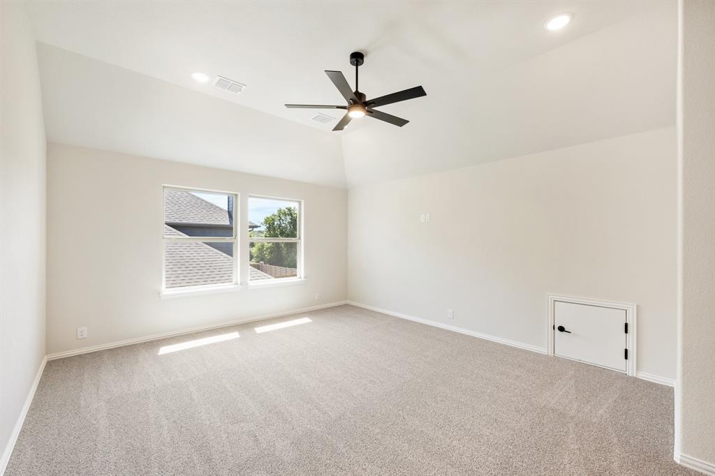 721 Seahawk Street Joshua, TX 76058 - Photo 28 of 40 an empty room with a window and a fan