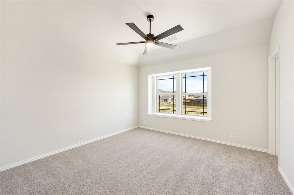 721 Seahawk Street Joshua, TX 76058 - Photo 35 of 40 an empty room with a window and a fan