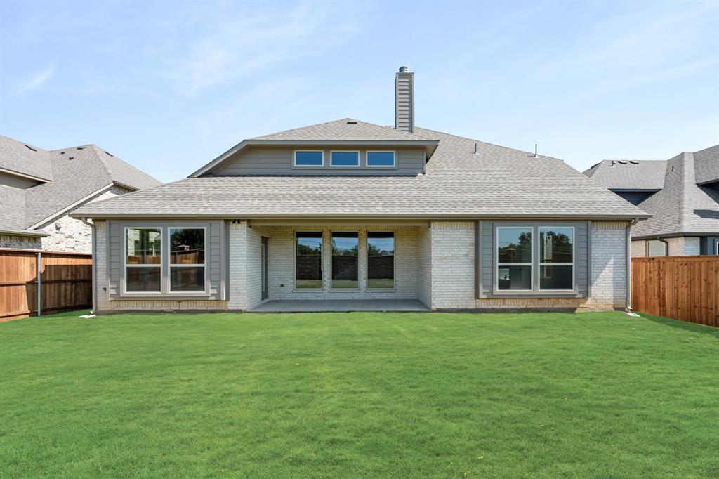 721 Seahawk Street Joshua, TX 76058 - Photo 38 of 40 a front view of a house with a garden and yard