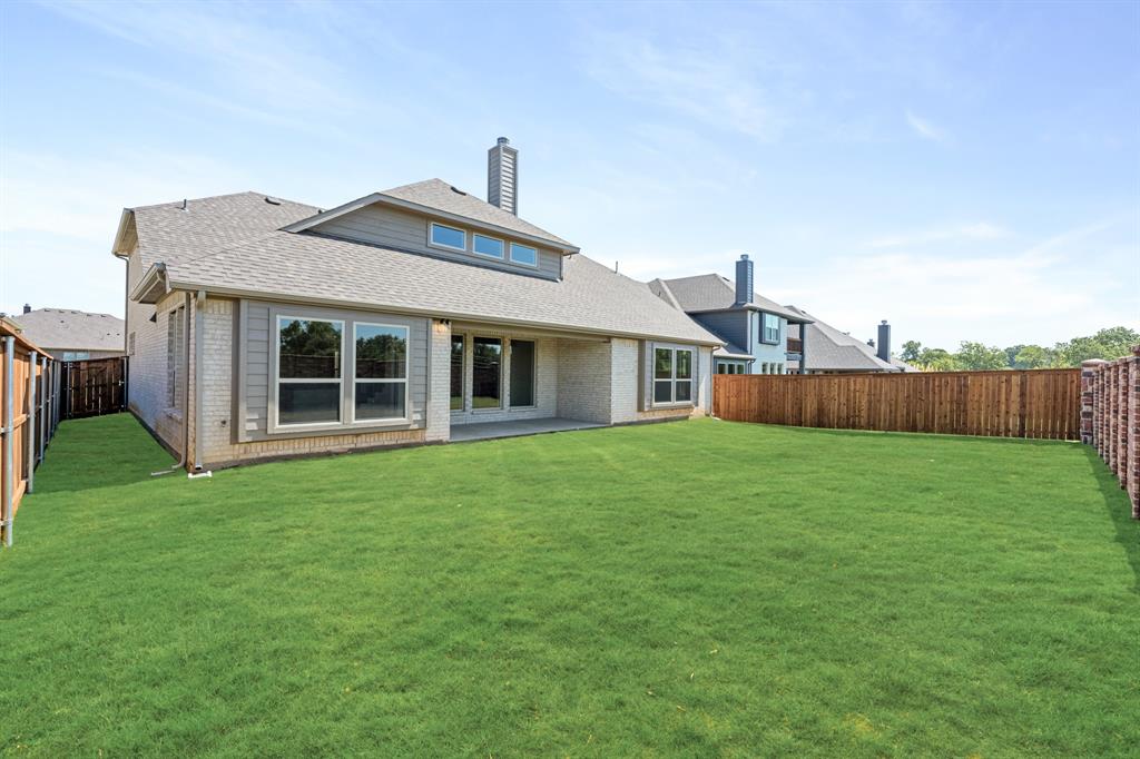 721 Seahawk Street Joshua, TX 76058 - Photo 39 of 40 a front view of a house with a garden