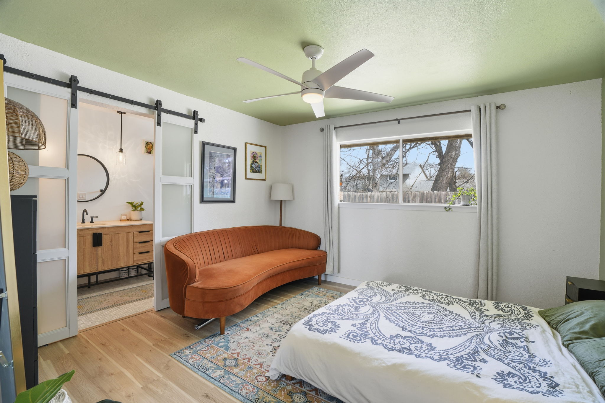 10305 Golden Quail Drive Austin, TX 78758 - Photo 22 of 39 a bedroom with a bed dresser and window
