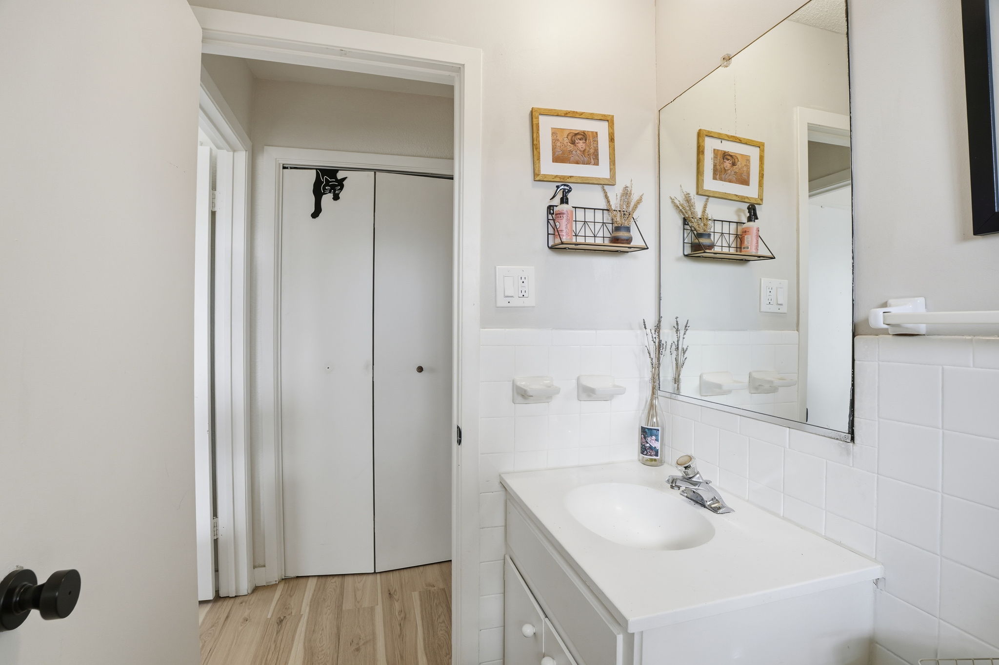 10305 Golden Quail Drive Austin, TX 78758 - Photo 25 of 39 a bathroom with a sink and a mirror