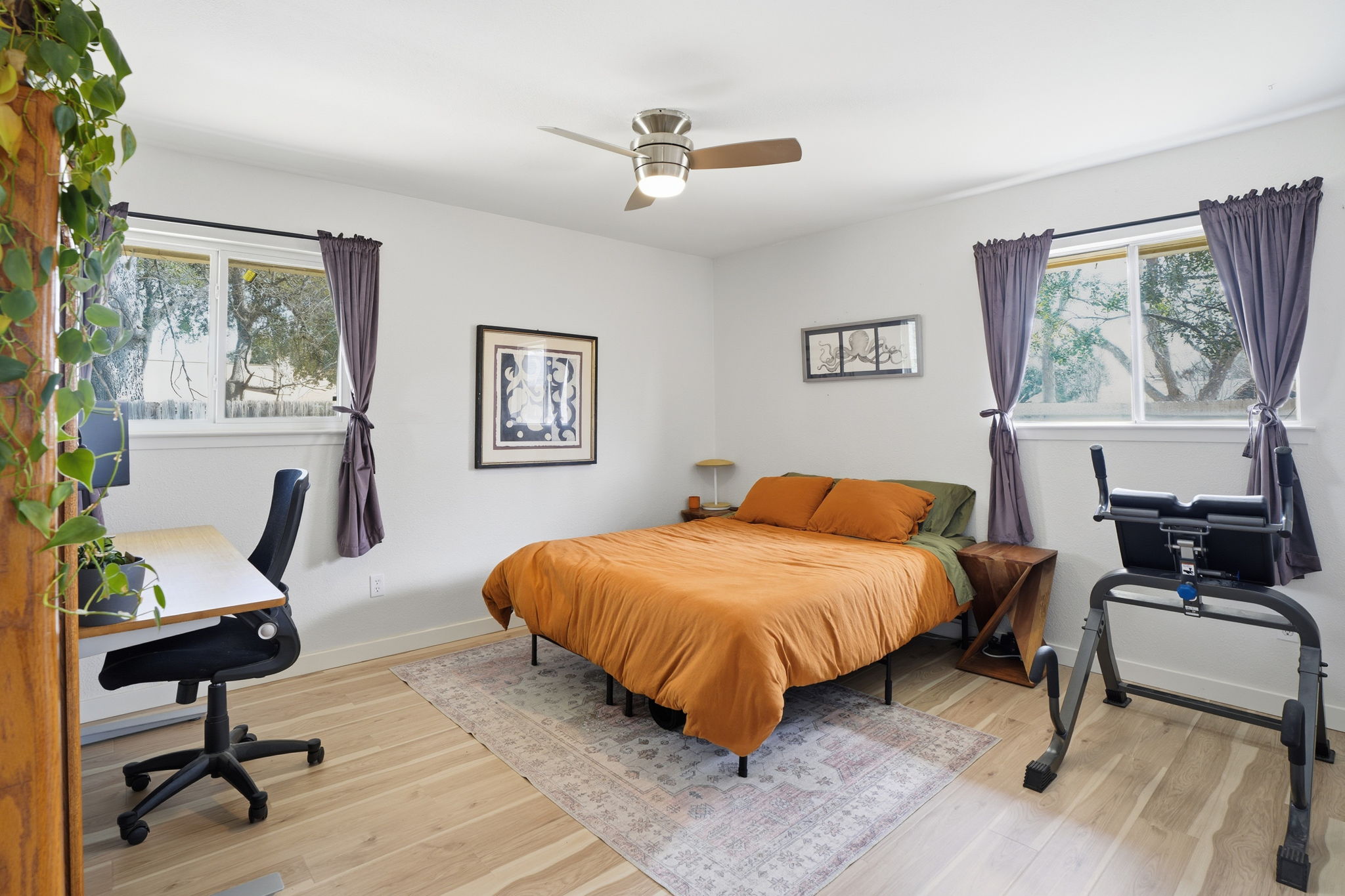 10305 Golden Quail Drive Austin, TX 78758 - Photo 29 of 39 a bedroom with a bed and a desk