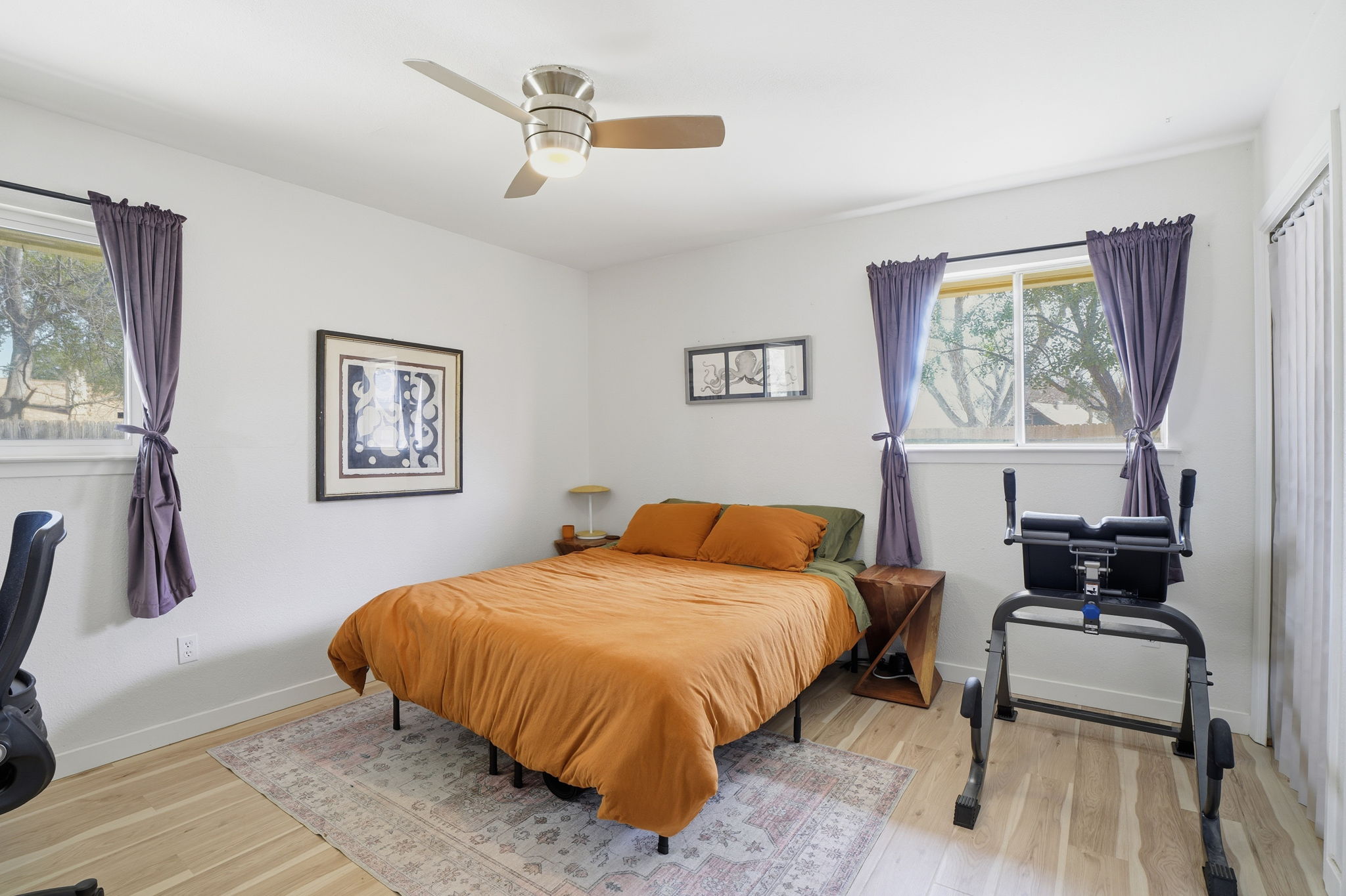 10305 Golden Quail Drive Austin, TX 78758 - Photo 32 of 39 a bedroom with a bed and a couch
