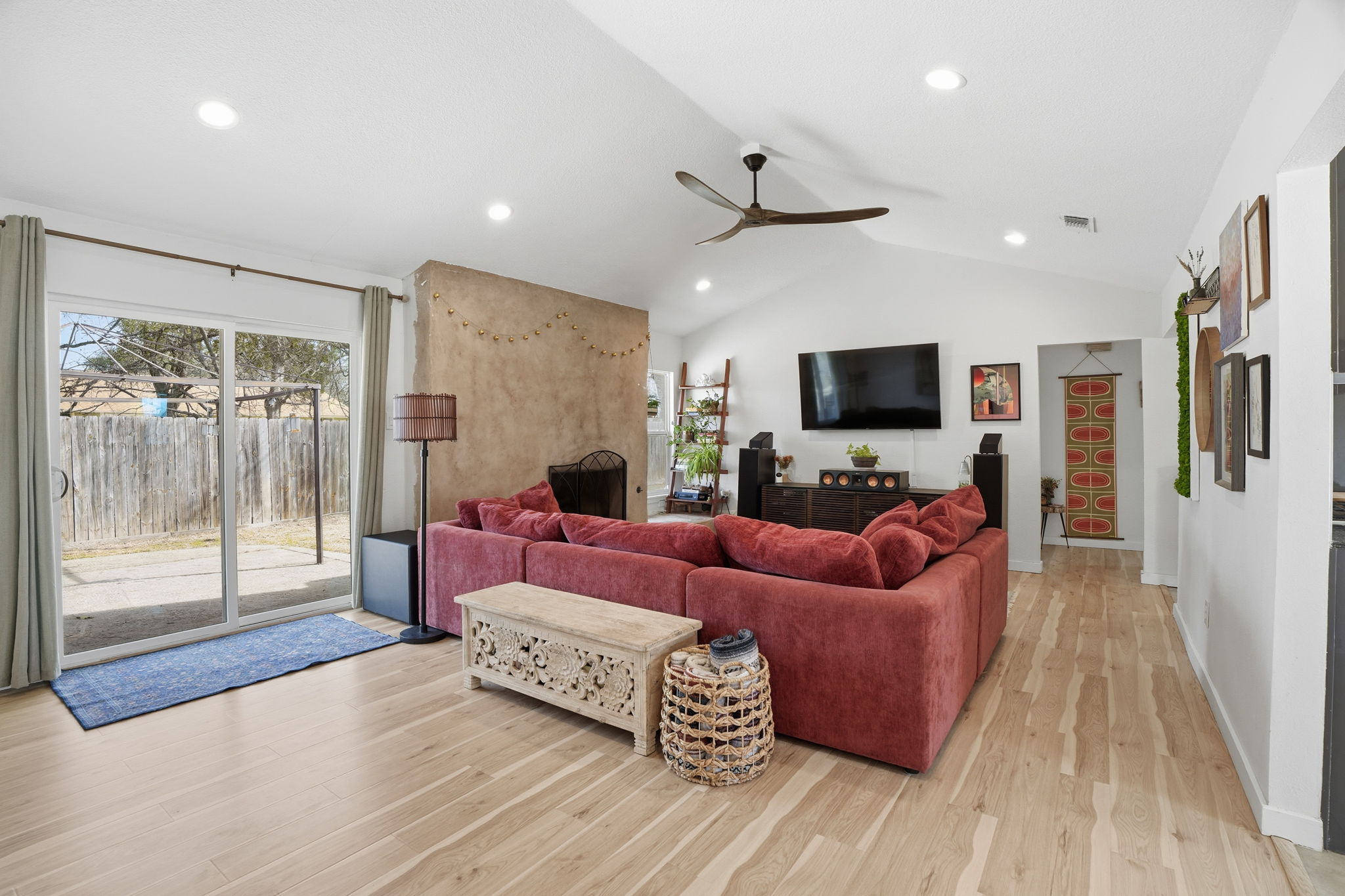10305 Golden Quail Drive Austin, TX 78758 - Photo 5 of 39 a living room with furniture and a flat screen tv