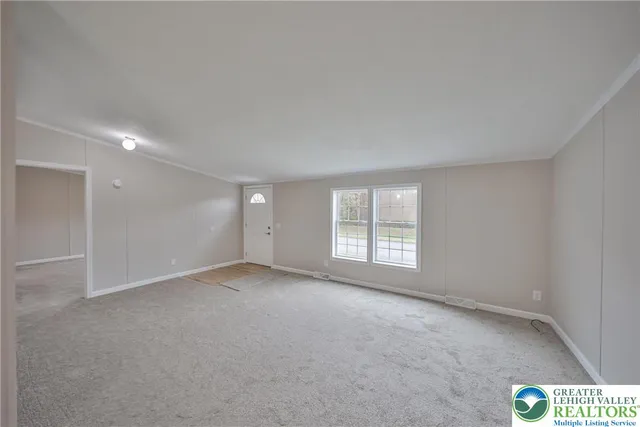 an empty room with windows