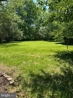 a view of outdoor space with deck and yard