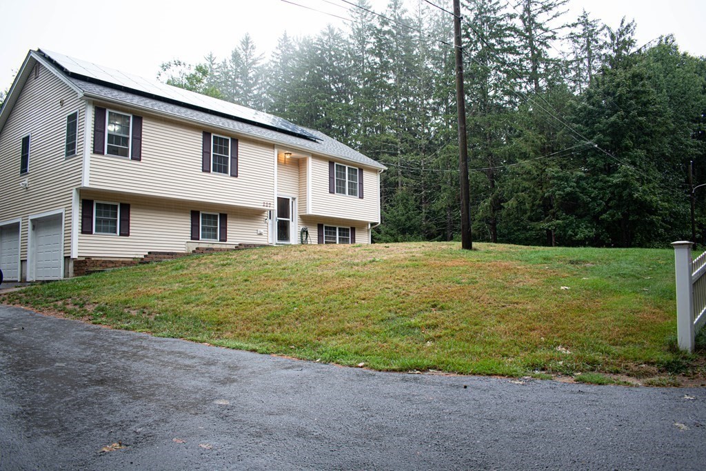 227 Turkey Hill Road Rutland, MA 01543 - Photo 1 of 30 a front view of a house with garden