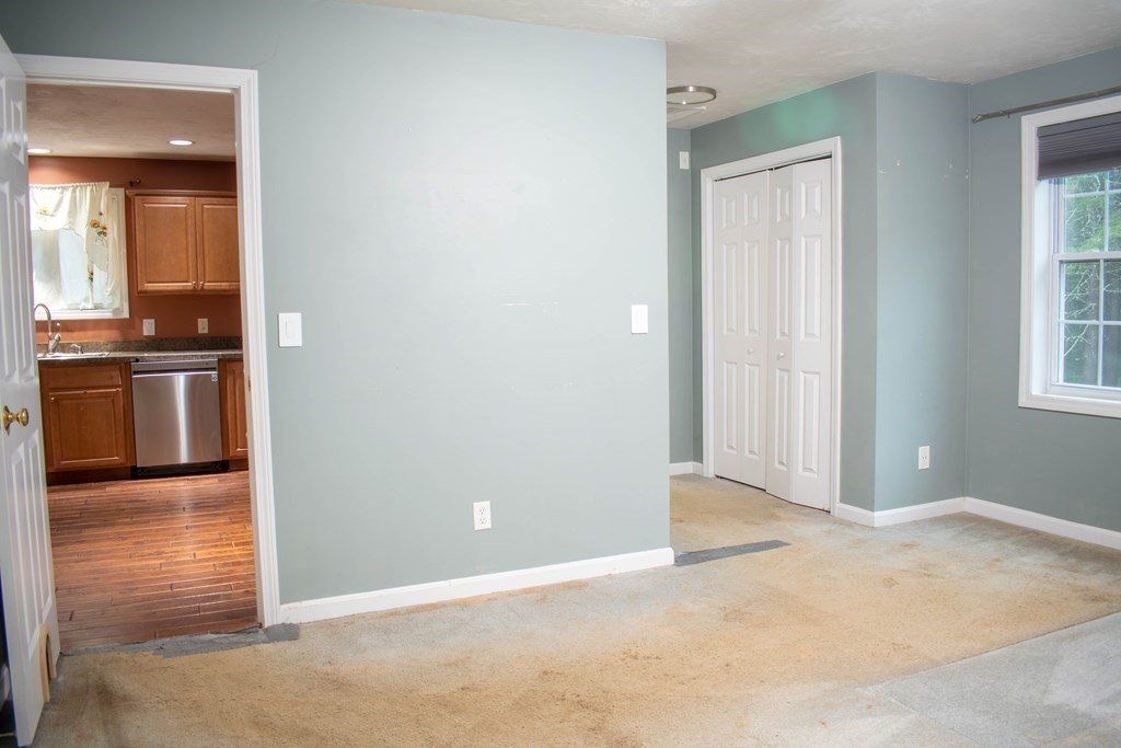 227 Turkey Hill Road Rutland, MA 01543 - Photo 12 of 30 an empty room with kitchen and a window