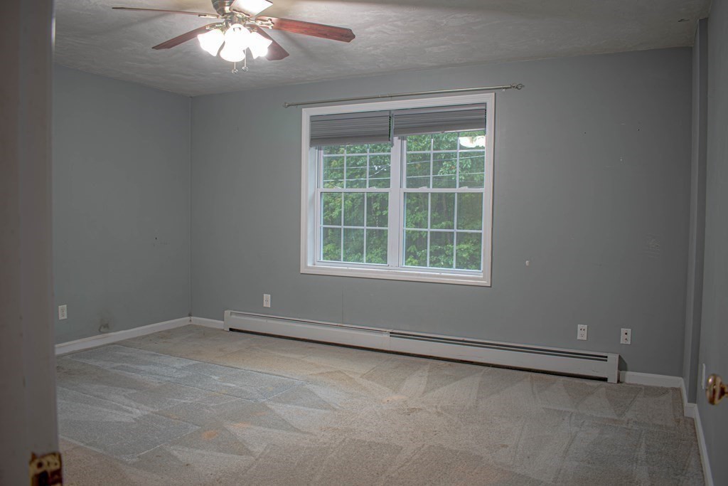 227 Turkey Hill Road Rutland, MA 01543 - Photo 13 of 30 an empty room with a empty space and windows