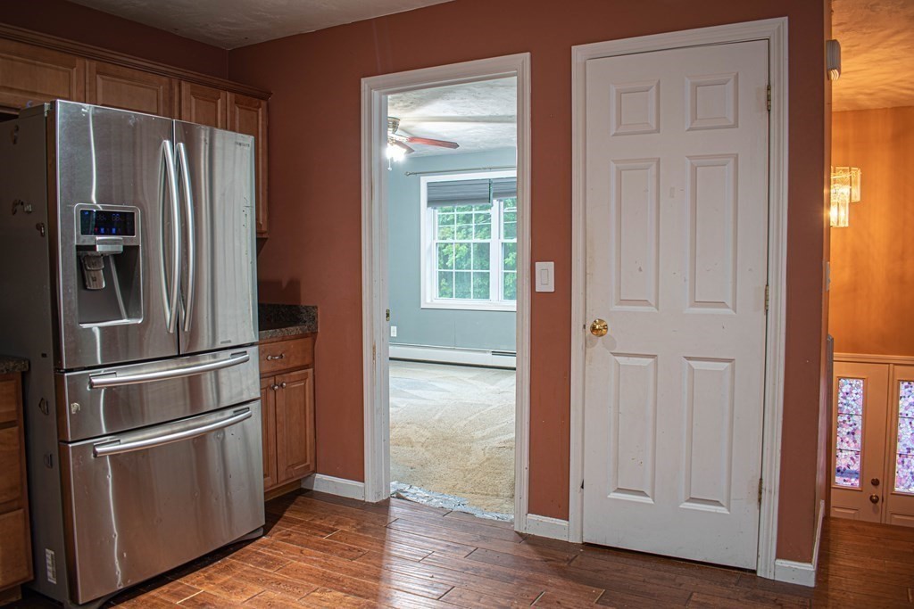 227 Turkey Hill Road Rutland, MA 01543 - Photo 7 of 30 a metallic refrigerator freezer sitting in a kitchen