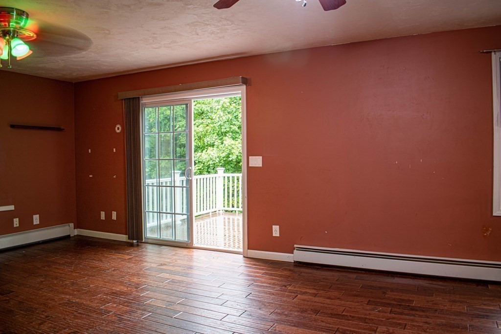 227 Turkey Hill Road Rutland, MA 01543 - Photo 8 of 30 a view of an empty room with wooden floor and a window
