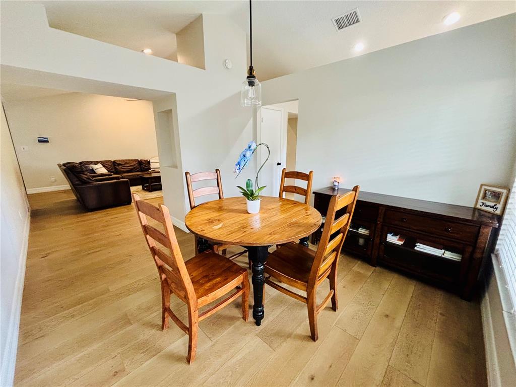1045 Shaffer Trail Oviedo, FL 32765 - Photo 7 of 30 a dining room with a table and chairs