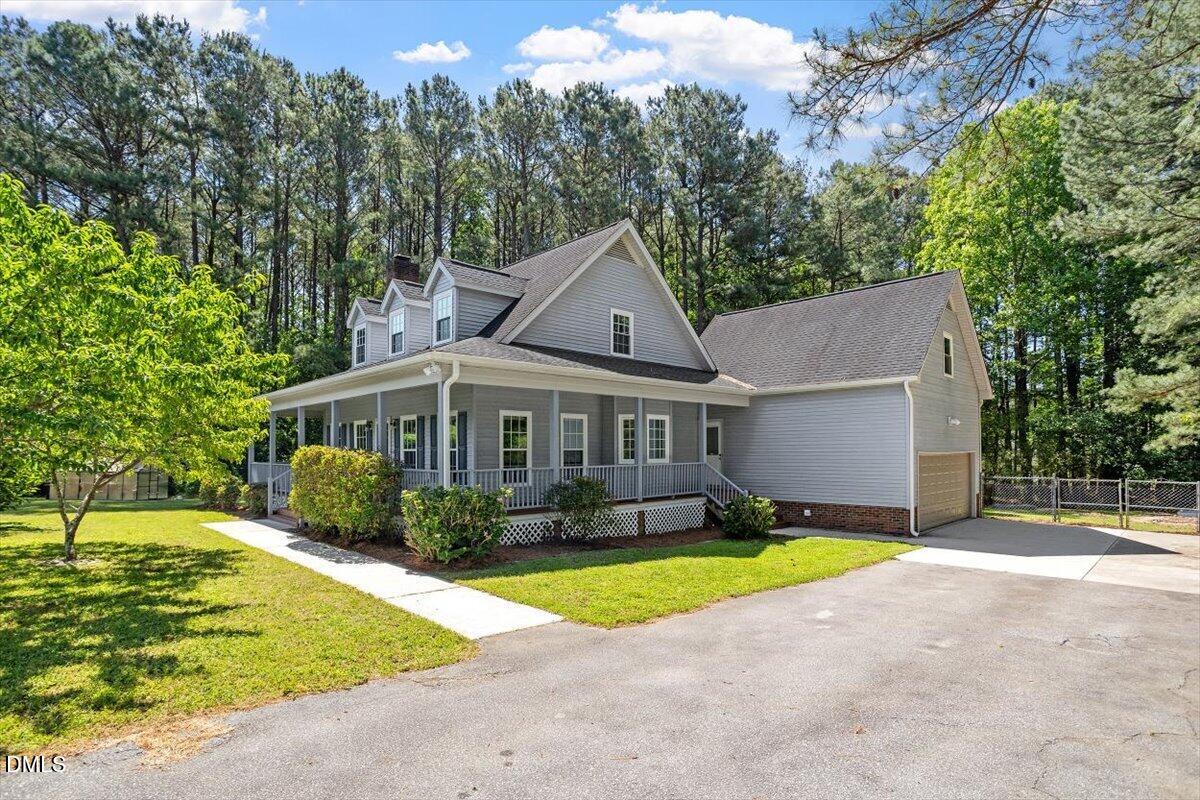 7505 Penny Road Raleigh, NC 27606 - Photo 3 of 35 a view of a house with pool and a yard