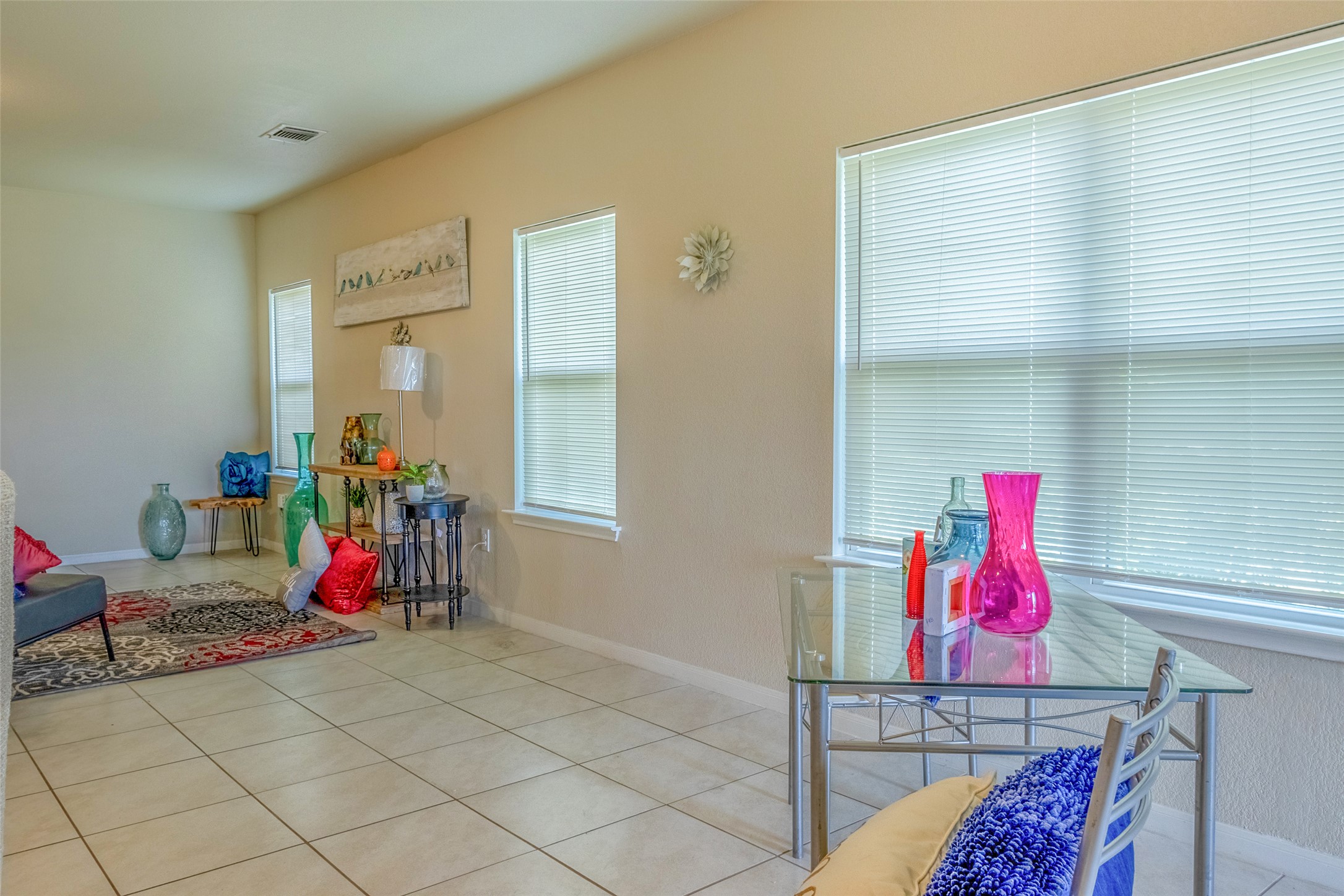 7225 Ranchito Drive Austin, TX 78744 - Photo 8 of 39 Natural illumination streams into this open living space with neutral tile flooring.