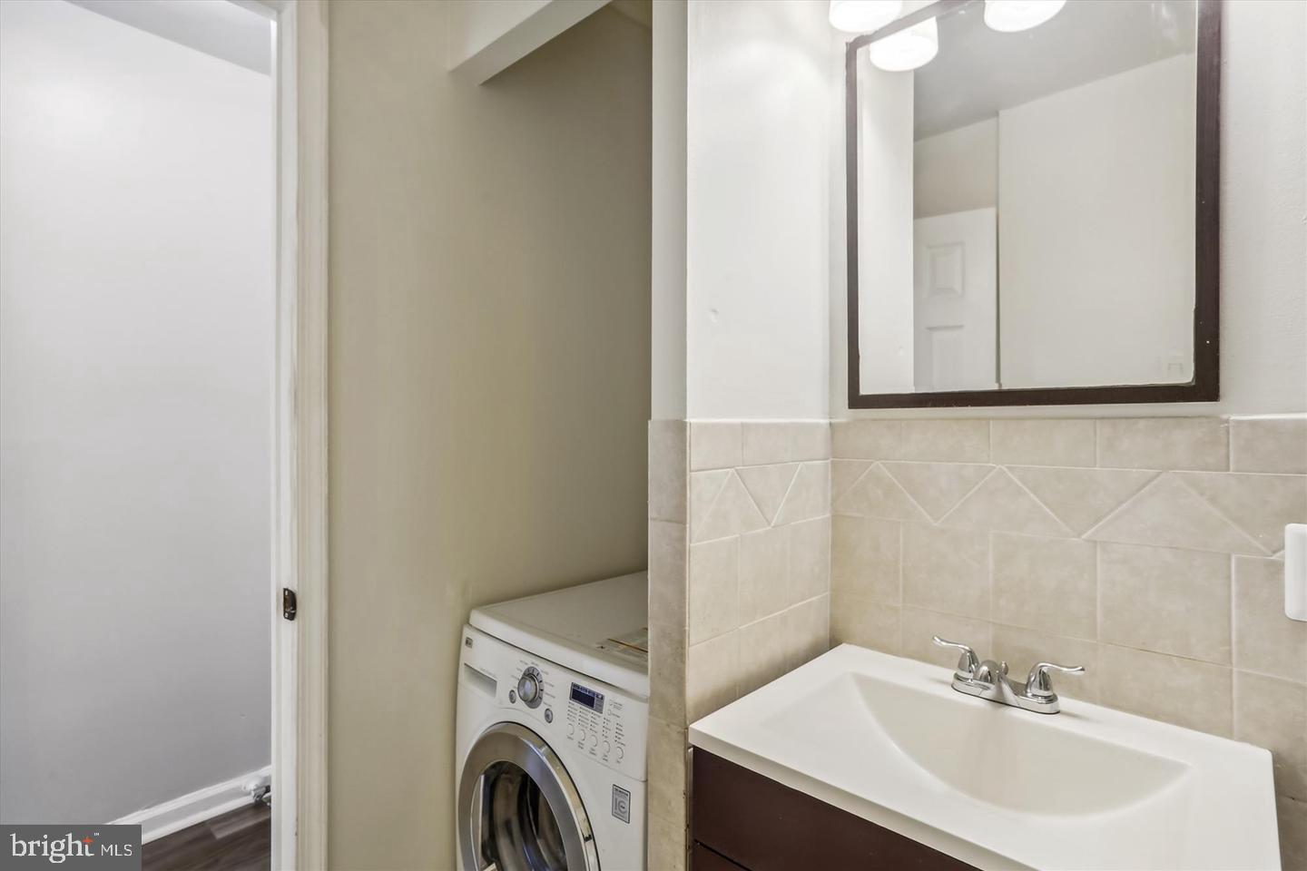 1900 Lyttonsville Road, Unit 602 Silver Spring, MD 20910 - Photo 15 of 43 a utility room with dryer and washer