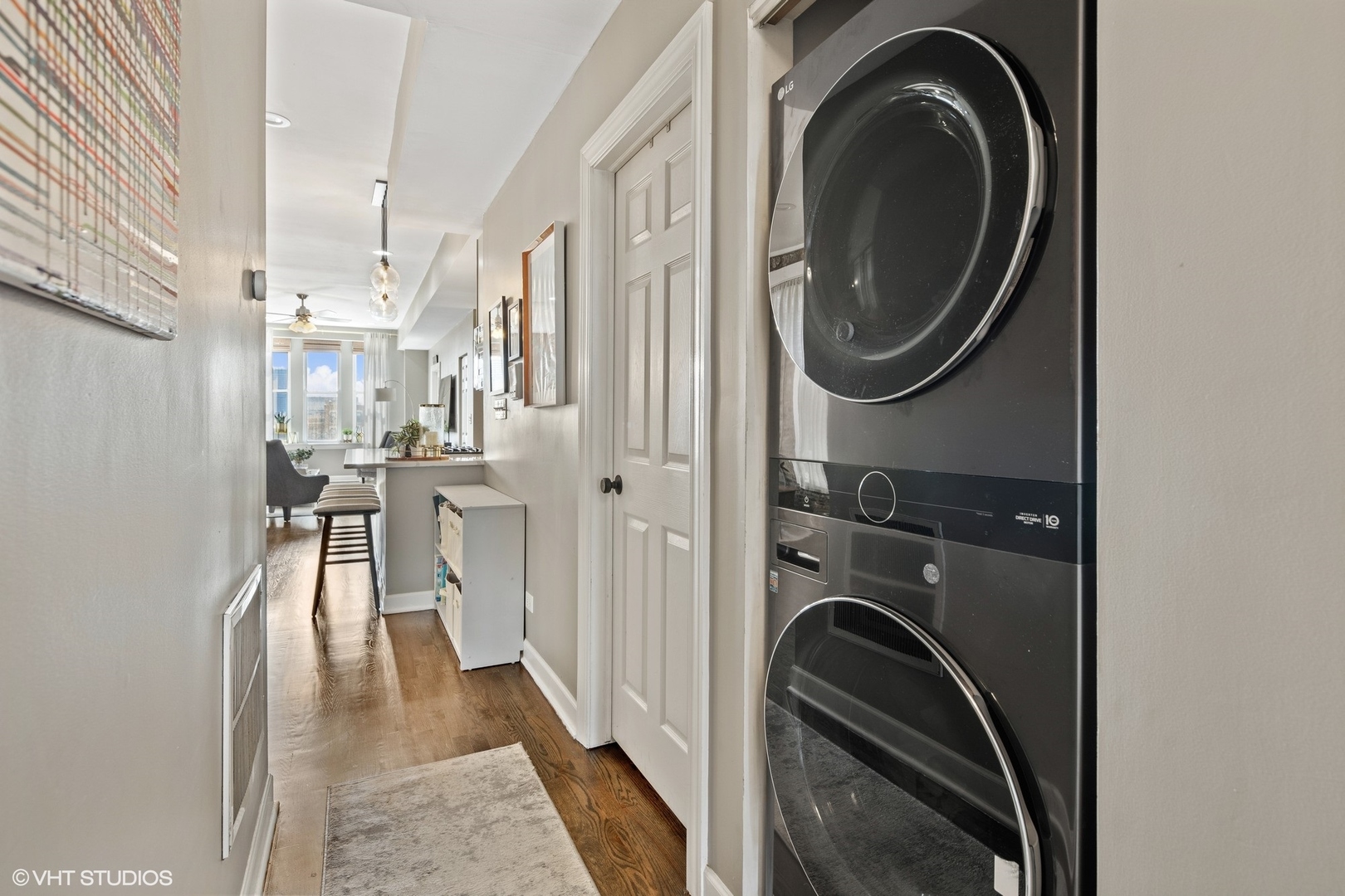 1326 West Huron Street, Unit 4 Chicago, IL 60642 - Photo 12 of 20 a view of a hallway with washer and dryer