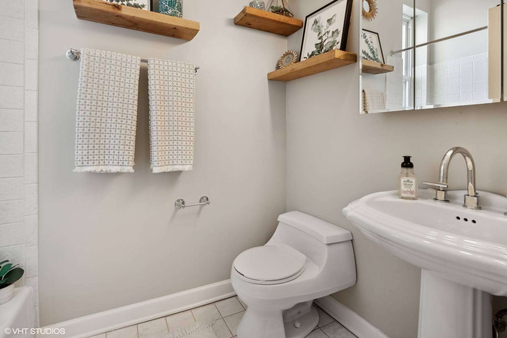 1326 West Huron Street, Unit 4 Chicago, IL 60642 - Photo 13 of 20 a bathroom with a sink and a toilet